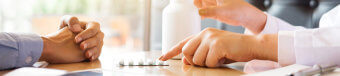 a picture of pharmacist precribing medicine to patient