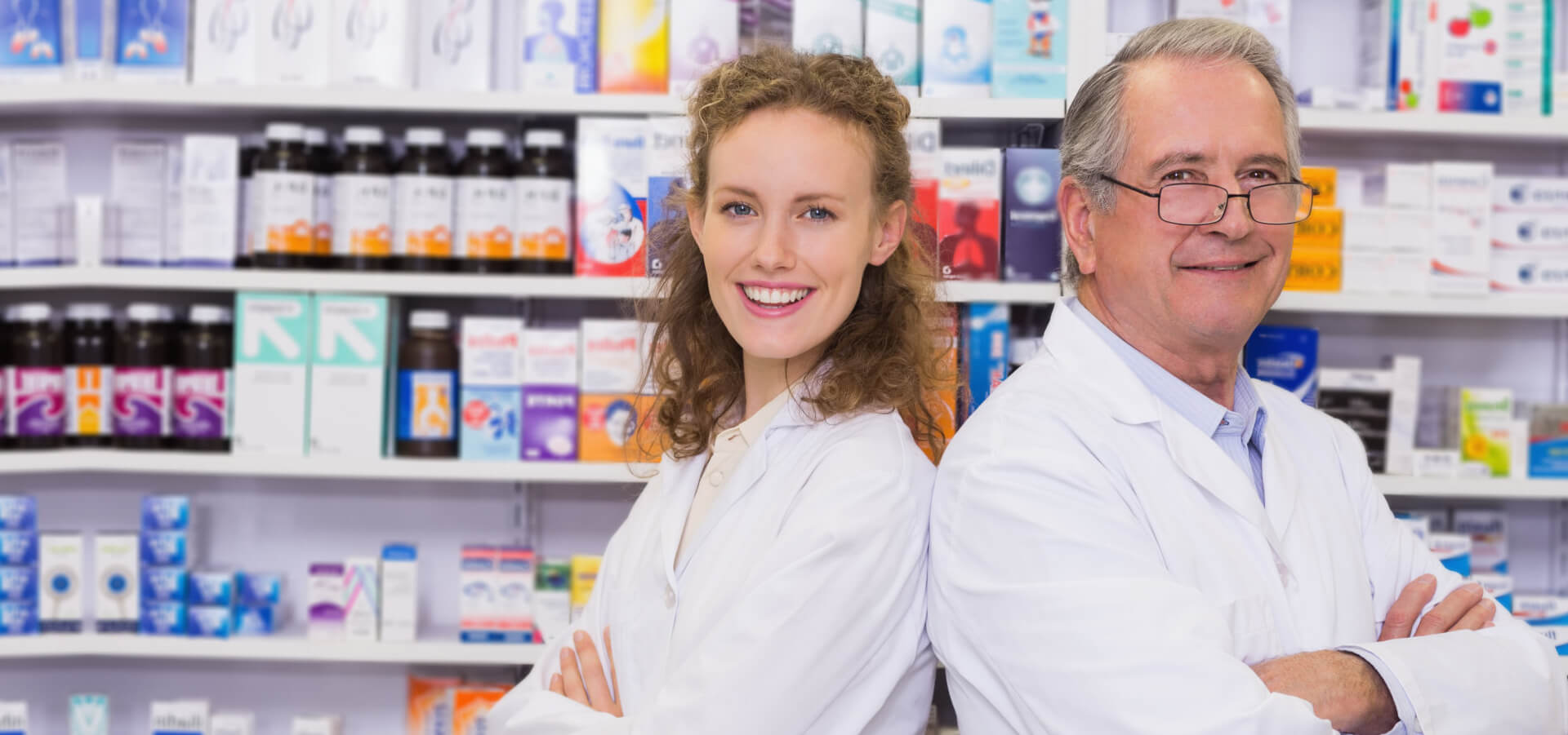 Pharmacists looking at the camera in the pharmacy