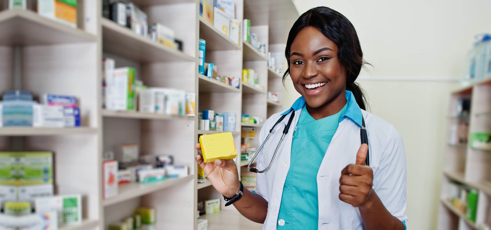 African american pharmacist working in drugstore 